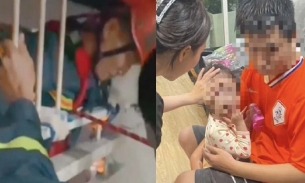 Cảnh sát đu dây từ tầng 18, giải cứu bé gái 2 tuổi mắc kẹt trong chung cư ở Đắk Lắk