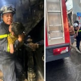 Hình ảnh cảnh sát giải cứu 3 cháu nhỏ mắc kẹt trong vụ cháy nhà dân tại Hà Nội