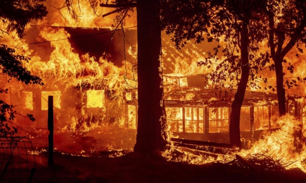 California’s largest fire torches homes as blazes lash West