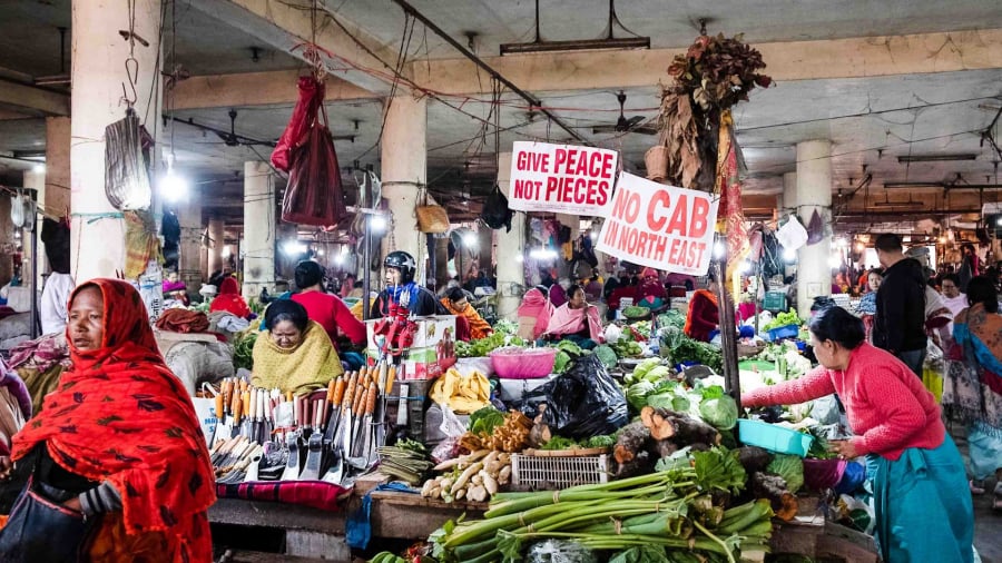 Ima-Keithel-India-market-Ima-Keithel-stalls-and-political-signs-EM-Photo-credit-Eileen-McDougall-1920x1080