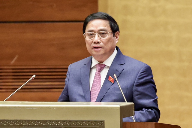 Thủ tướng Phạm Minh Chính trình bày Báo cáo kết quả thực hiện kế hoạch phát triển kinh tế-xã hội năm 2022; dự kiến kế hoạch phát triển kinh tế-xã hội năm 2023 - Ảnh: VGP/Nhật Bắc